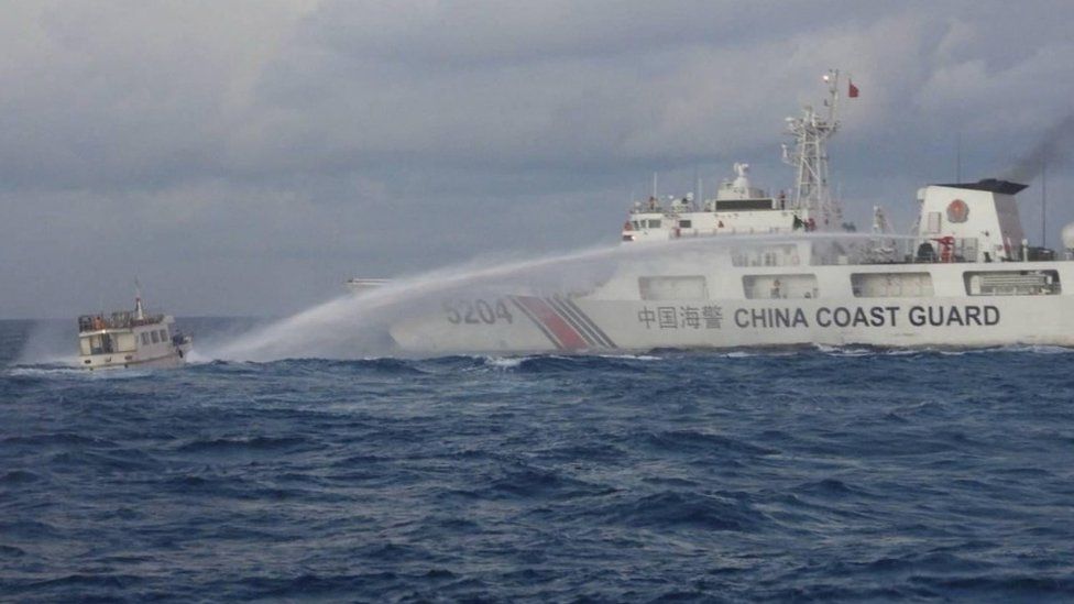A Chinese Coast Guard ship uses a water cannon against a Filipino resupply vessel heading towards the disputed Second Thomas Shoal, in the South China Sea, on 10 December
