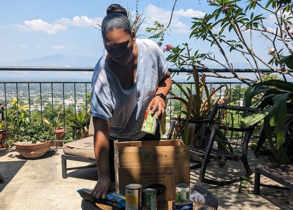 Tatiana packing food in Port-au-Prince