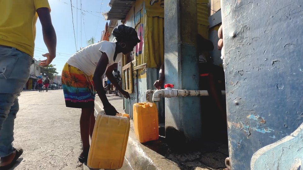 Farah Oxima collecting water