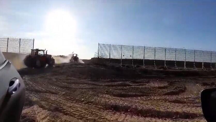 This is a screengrab of a video showing tractors crossing over one of the two metal barriers that separate Israel from Gaza. The video was filmed on February 22.
