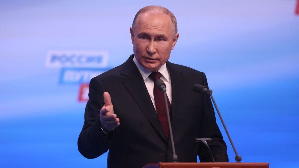 Russian President Vladimir Putin speaks during his press conference at his campaign headquarters, early 18 March, 2024