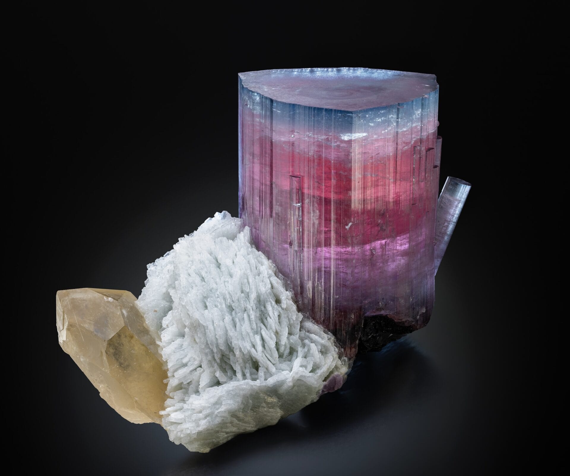 A composite mineral with different types of crystals and textures.