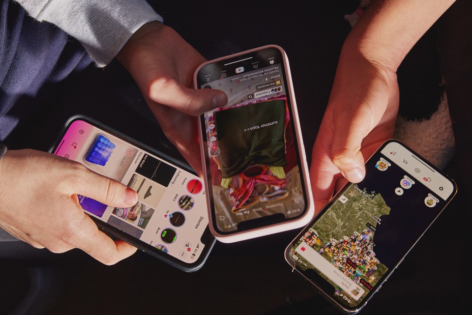 overhead image of teens hands with phones