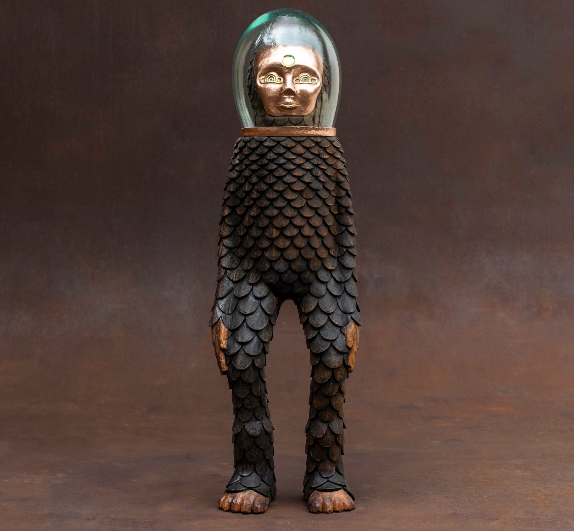 a character with a pinecone like body and a clear mask over its face