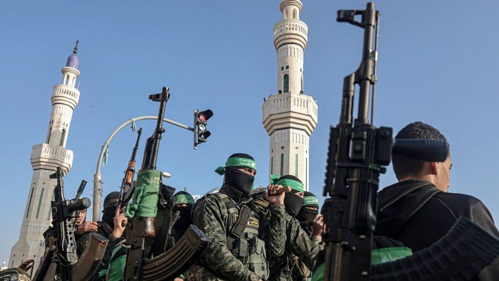 Members of the Izzedine al-Qassam Brigades, the armed wing of the Palestinian Hamas movement, attend the funeral of their comrade Mohammed Abed during his funeral in Rafah in the southern Gaza Strip on February 16, 2022.